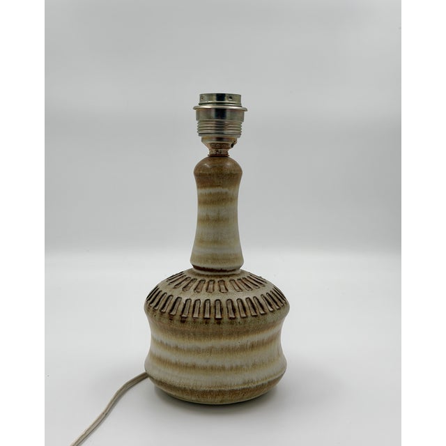 This authentic Mid-Century modern table lamp was designed by Joseph Simon for the renowned Danish manufacturer Søholm...