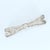 This bow-shaped brooch features intricate detailing with a series of diamonds set throughout its design. Stone Info: Old...