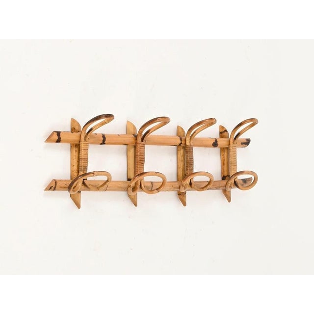 Wonderful French Riviera style coat rack fully made of curved rattan, bamboo, and hand-woven wicker. This stylish organic...