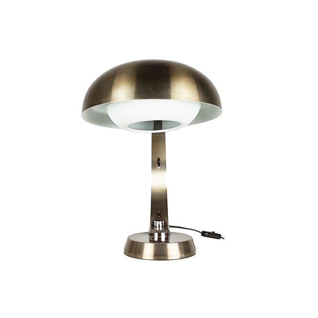 Table or desk lamp produced in Italy in the 1960s. Anodized aluminun with bronze finish. Shade and countershade in white...