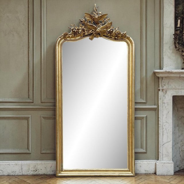 Grand 19th Century French Louis XVI Gilded Mirror is a masterpiece of the sculptor's art! The large scale of the mirror...