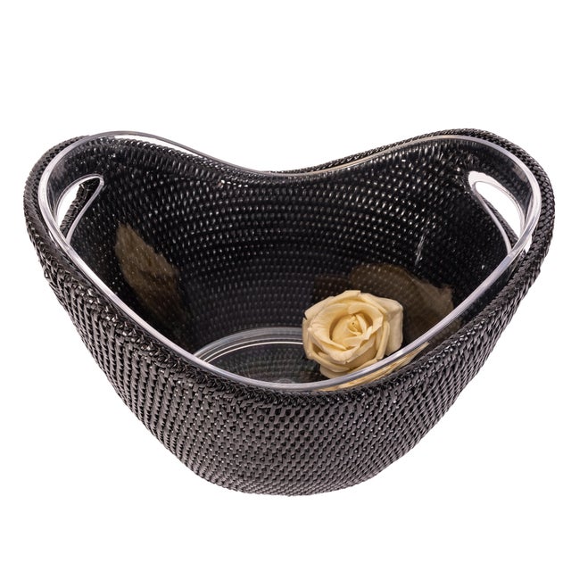 The new rattan champagne bucket with an acrylic insert gives your champagne or wine a modern display while keeping it...