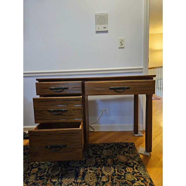 Ranch oak desk, solid wood construction Includes 1 matching chair Estimated chair dimensions: 31" H, 16" W, 16" deep, and...