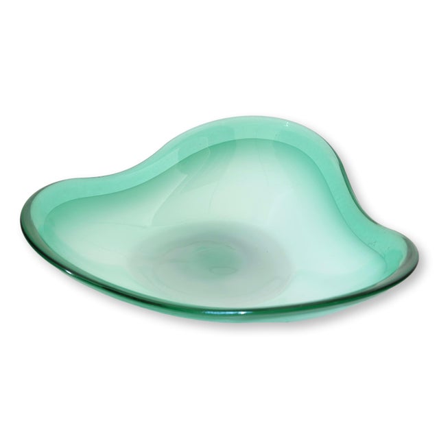 Midcentury Italian Murano art glass bowl in a soft sea green tone with an elegant freeform silhouette typical of 1960s...