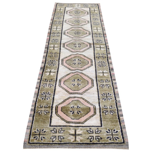 Hand-knotted with care using traditional rug making techniques, this wool rug blends timeless craftsmanship with a modern...