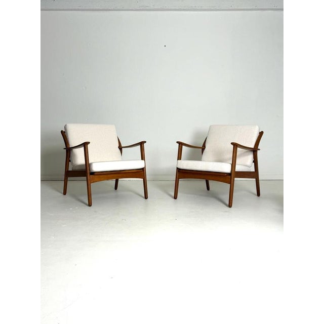 Pair of Niels Kofoed Teak Lounge Chairs, 1960s An elegant pair of Danish lounge chairs designed by Niels Kofoed and...