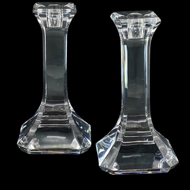 Pair of elegant crystal candlesticks in Orrefors’ “Regina” pattern. These elegant candlesticks are crafted from glossy,...