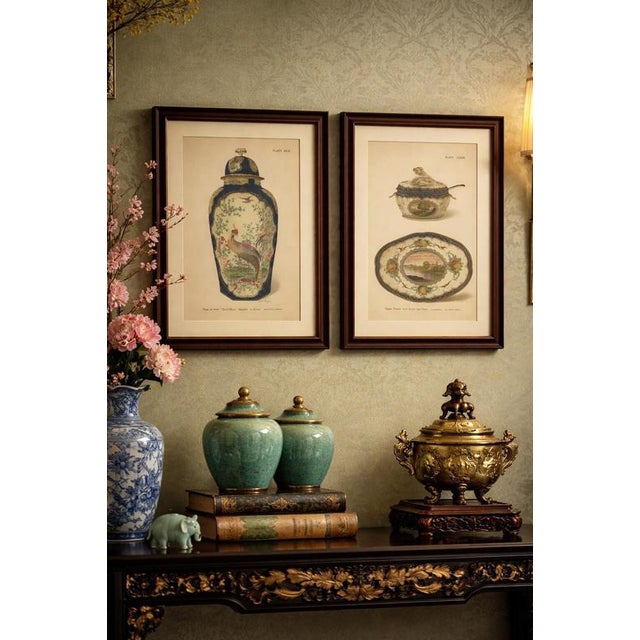 This decorative pair of chromolithographic plates from 1910 illustrates two refined english porcelain vase designs...