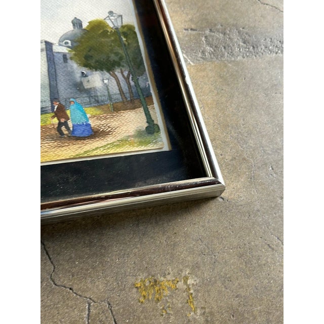 W16.5 H13 Church scene painting by Ernesto Bonilla, with a chrome frame.