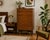 A mid-century Meredew tallboy chest crafted in walnut veneer and dating to the early 1960s. Featuring six spacious drawers...