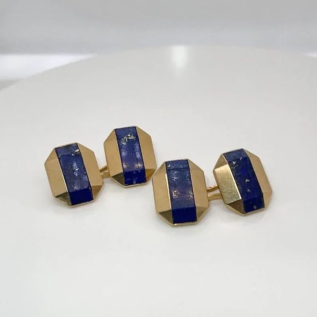 A fine pair of antique Art Deco cufflinks. By Boucheron. In 18k gold. Each with octagonal, faceted gold heads with lapis...