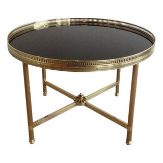 1940s Round brass coffee table with black lacquered glass top Attributed to Maison Jansen For Sale