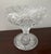 8" high American Brilliant period cut crystal footed bowl/compote, late 19th century. It is decorated all over with a...