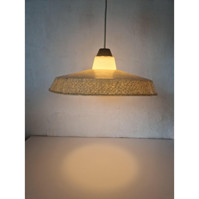 Rare lamp designed by Louis Kalff for Philips in the 1950's. A large shade of fiberglass around a geometrical shaped...