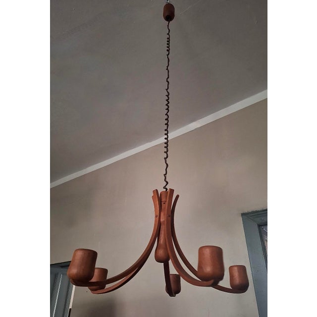 Danish teak chandelier by Domus with 5 arms, 1970s, 60 cm diameter, height variable between 100 cm and 175 cm. I have...