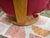 Details ChairWorks Red Leather Upholstered Reclining Swivel Armchair and Ottoman, circular tripod bases, each labeled...