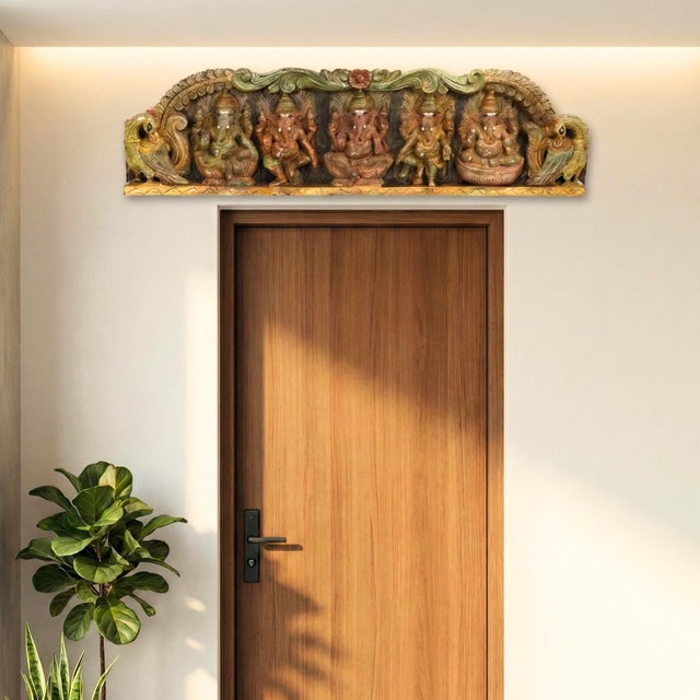 Invite the essence of wisdom and prosperity into your home with this breathtaking Traditional Indian Carved Wooden Ganesha...