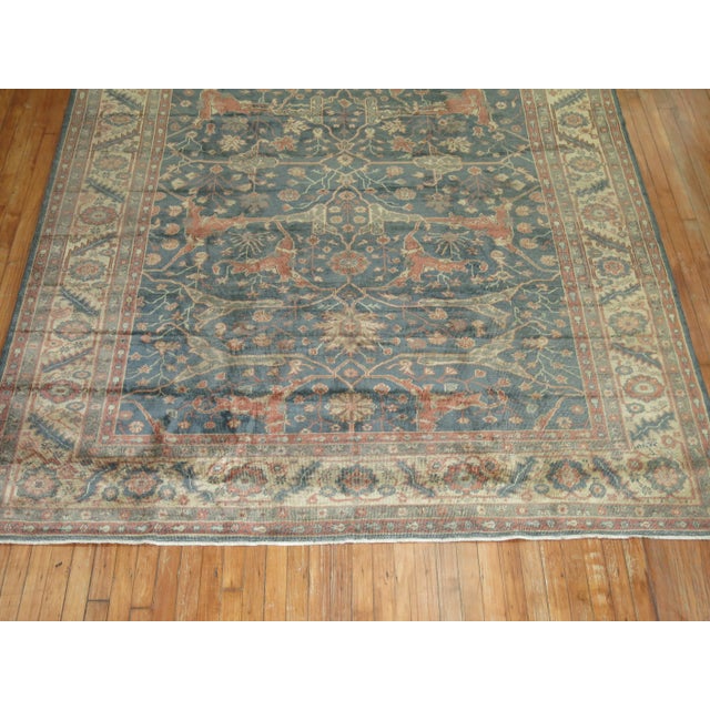 A mid 20th Century room size Turkish Rug with an all-over large scale design on a green field. Accents in cream and...