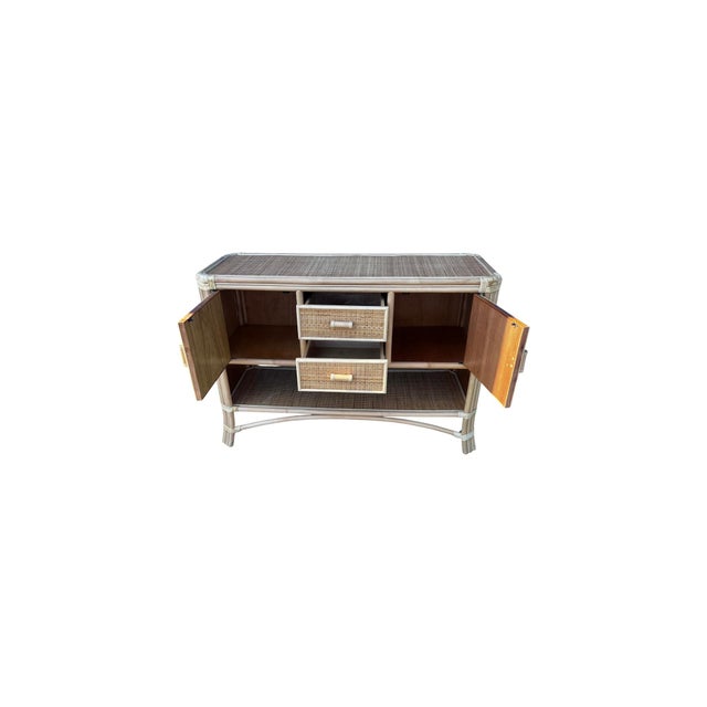 Vintage sideboard features sturdy bamboo construction, rattan wicker, and its original natural finish. It is in very good...