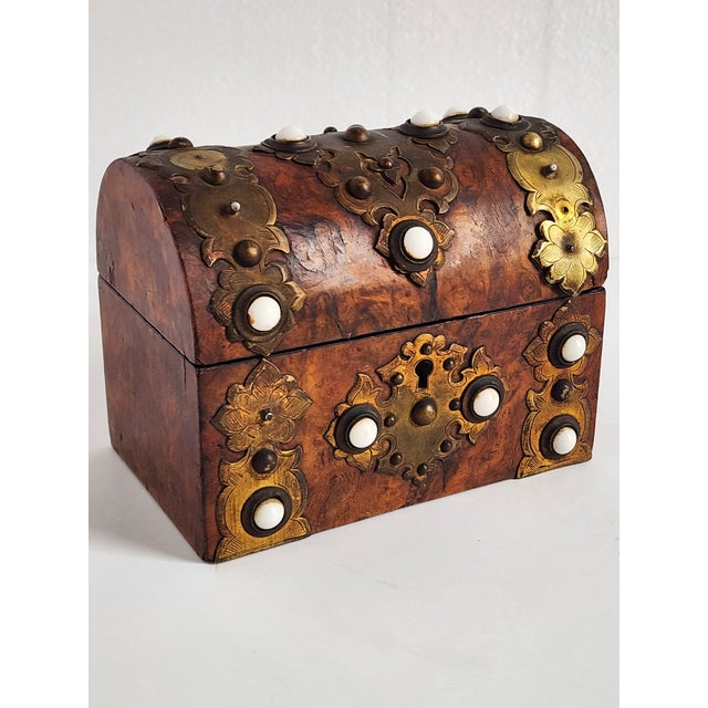 Antique 19th Georgian burr walnut veineer dome top casket box, mounted with Gothic style brass strapwork and white insert...