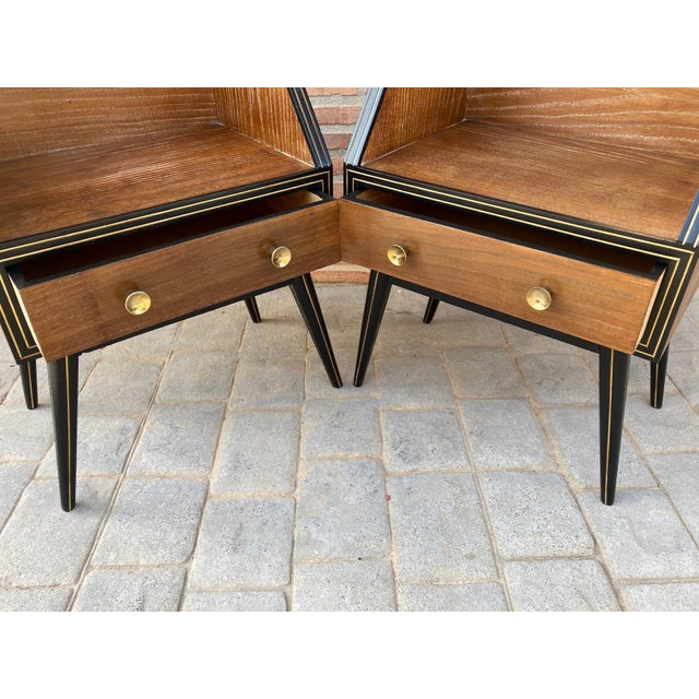 Elegant and stylized 1960s mid-century Italian nightstands, with clear glass, on top. You can see the refined details like...