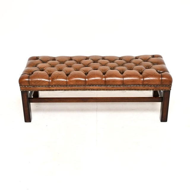 A fantastic antique leather stool / bench. This is in the classic Georgian style, it was made in England and dates from...
