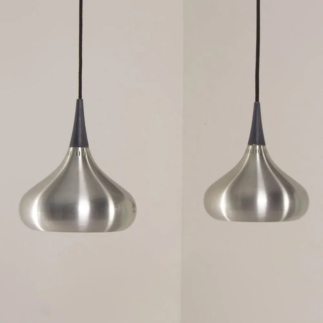Set of two Danish pendant lamps designed by Jo Hammerborg for Fog & Morup in 1963. Jo Hammerborg was artistic director of...