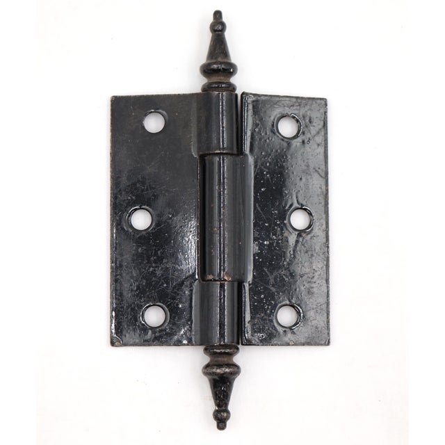 This door hinge is made of black finish steel with steeple tips, three knuckles, and a template hole pattern. The original...