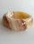 Vintage Mid-Century unevenly banded marble onyx ashtray or catchall dish in warm, neutral coastal sand colors. Round...