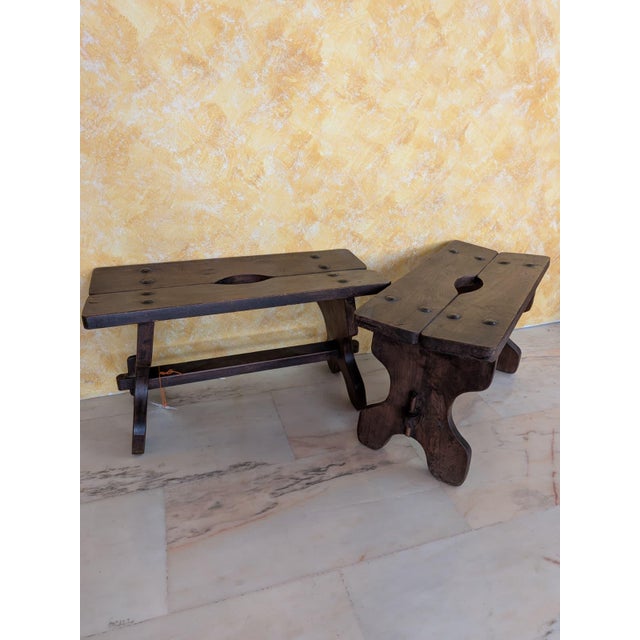 Pair of Spanish Castilian benches in a rustic style made of solid wood, whose artisanal design dates back to the beginning...