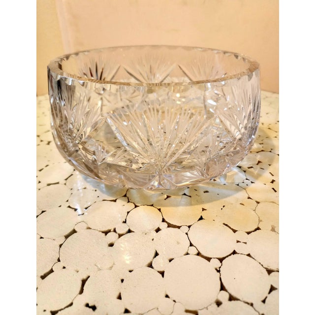 This a beautiful symmetrically crystal cut bowl and very heavy. Excellent to hold / store your fresh fruit as the...
