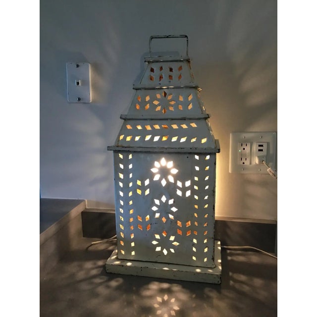 Rustic and charming, perforated tole lamp found at an estate sale at a Michigan farm. As you can see, the cuts in the lamp...