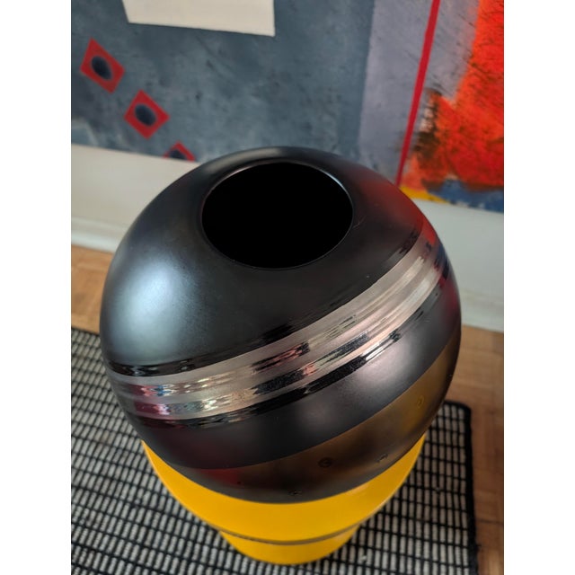 Metallic gold and silver shine on a matte black background. Definitely a statement piece.