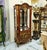 Bring timeless French elegance into your home with this extraordinary hand-painted curio cabinet, featuring glass display...