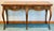 Milling Road French country flip top console table by Baker Furniture. Standing on cabriolet legs this table can adapt to...