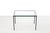 Minimalist black metal side table with a thick glass top from the 1970s. The table is 36 cm high by 50 cm wide and 35 cm...