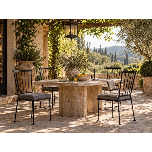 Stylish set of four vintage 1970s outdoor garden dining chairs featuring slender black-painted metal frames with tall open...