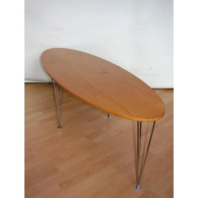 Low coffee table, 1980s. It was made of metal and oak veneer. Dimensions: height 31cm width 180cm head 50cm