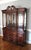 Mahogany China Cabinet with Inlay The china cabinet has four glass doors and a mirrored back. It has two side doors for...