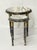 A charming and highly decorative set of two French Louis XVI-style circular guéridon or occasional tables, dating to the...
