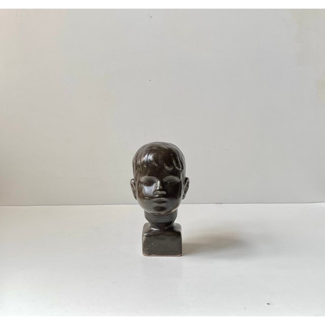A stylish mid-century young boy head bust designed by johannes m. Pedersen and gustav ottosen for their own ceramic studio...