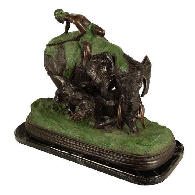A large antique Animalier bronze sculpture group: lion hunting with elephants by Antonio Amorgasti 1880-1942, Belgium,...