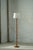 A beautiful and sculptural Scandinavian floor lamp in solid pine, Denmark, circa 1970s. The lamp features a tall, slender...