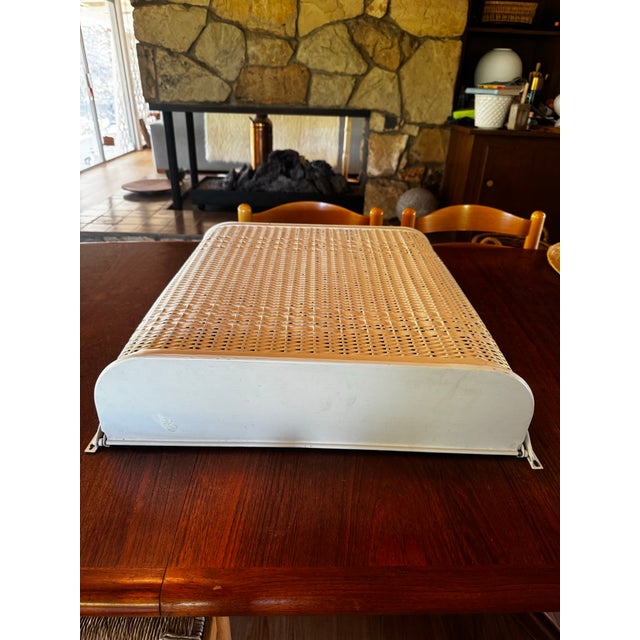 Rare midcentury woven wicker wall-mounted laundry hamper. The metal lid top lifts up to place items inside. Unique hinges...