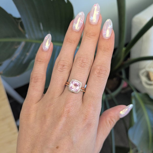 This minimalist curved stackable band is crafted in solid 14K gold with a sleek contour design that fits beautifully...