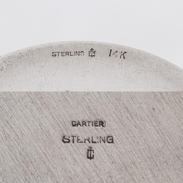 A mid 20th century cartier jewellery box crafted from solid silver, adorned with a exquisite gold plated lid handle. This...