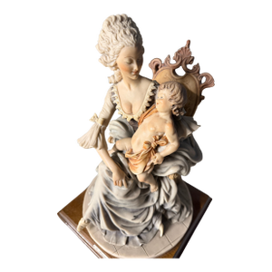 Late 20th Century Giuseppe Armani "Lady With Child" Figurine on a Wooden Base.
