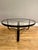 Manufactured by Gubi Denmark This Black leather Jacques Adnet Circulaire Coffee table in stitched black leather, brass...