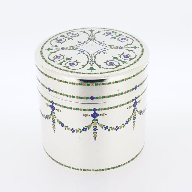 A fine Art Deco period silver & enamel covered box. In sterling silver. By Tiffany & Co. Decorated throughout with...
