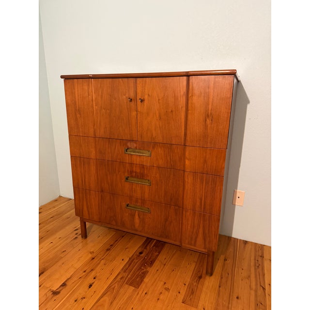John Widdicomb of Grand Rapids vintage mid century highboy dresser. Features 3 drawers on bottom, walnut veneer, and brass...